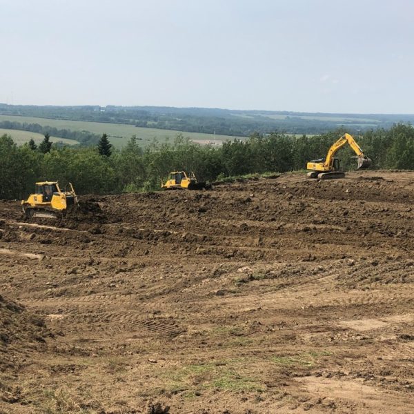 Spreading backfill to complete reclaim of site