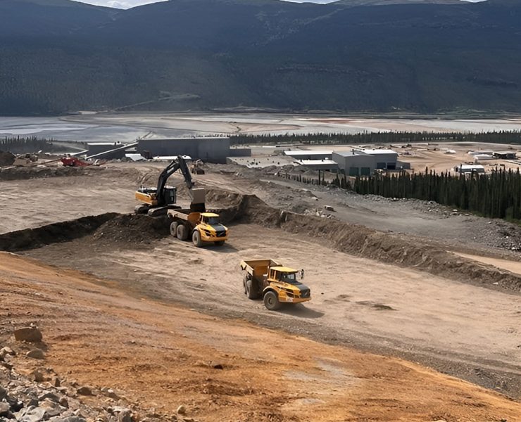 excavator loading rock truck