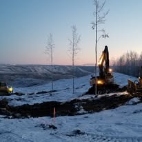Excavator loading a rock truck ACL Construction Fort St. John